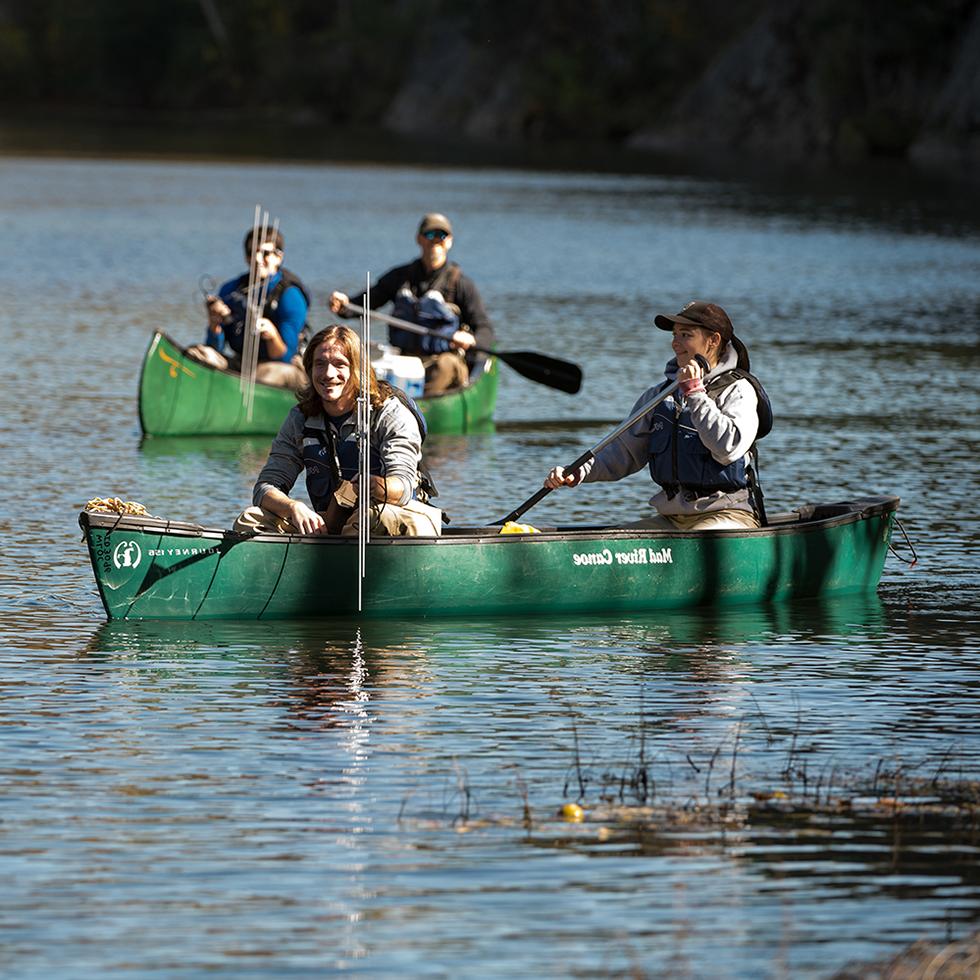 Students in canoes on a river